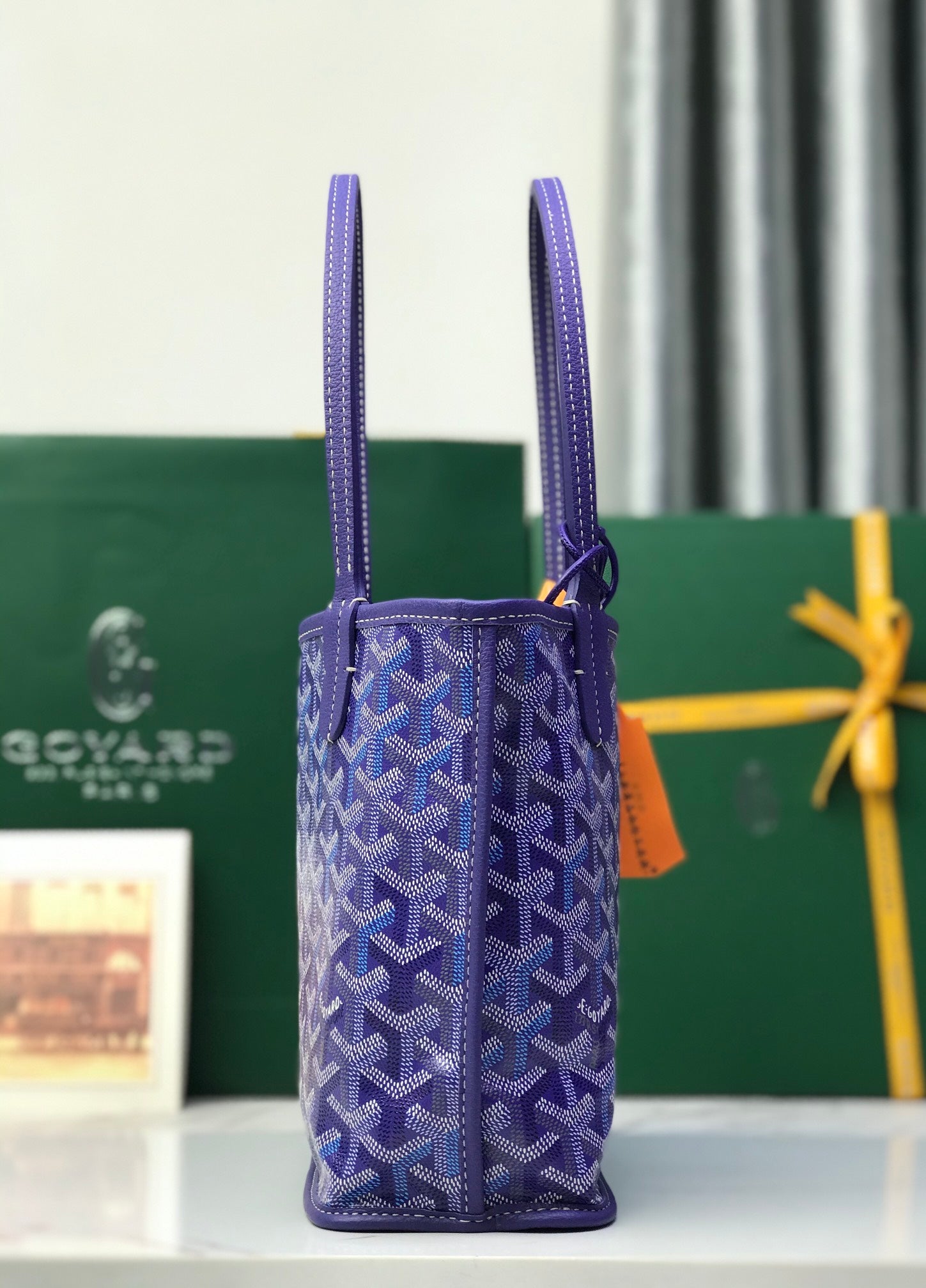 Goyard purple monogram mini bag accessory with two leather handles