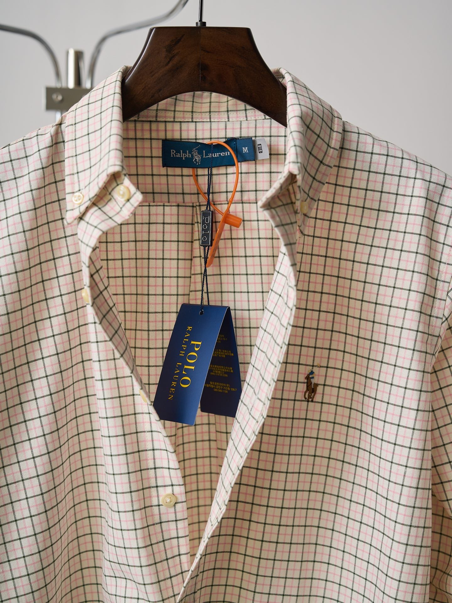 Ralph Lauren plaid button-up shirt with spread collar and brand label at neckline