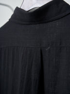 Black button-up shirt collar and yoke seam detail