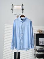 Light blue button-up dress shirt with spread collar and button placket