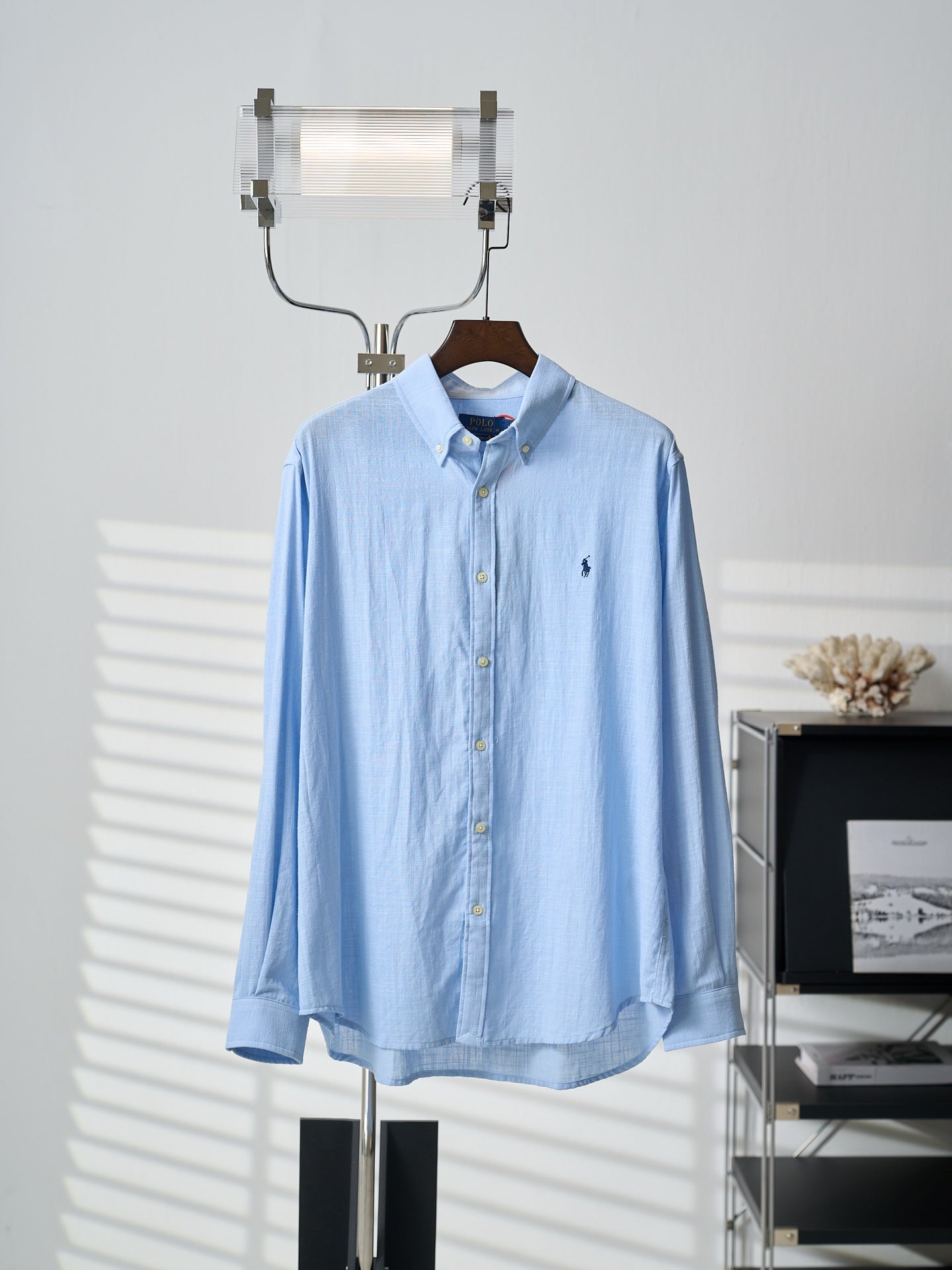 Light blue button-up dress shirt with spread collar and button placket