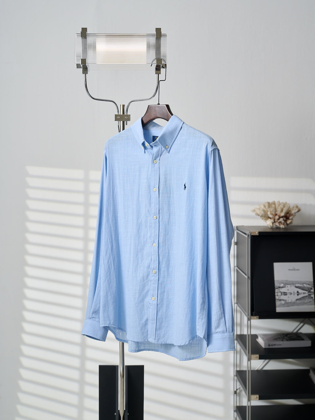 Light blue button-up dress shirt with small chest pony logo and long sleeves