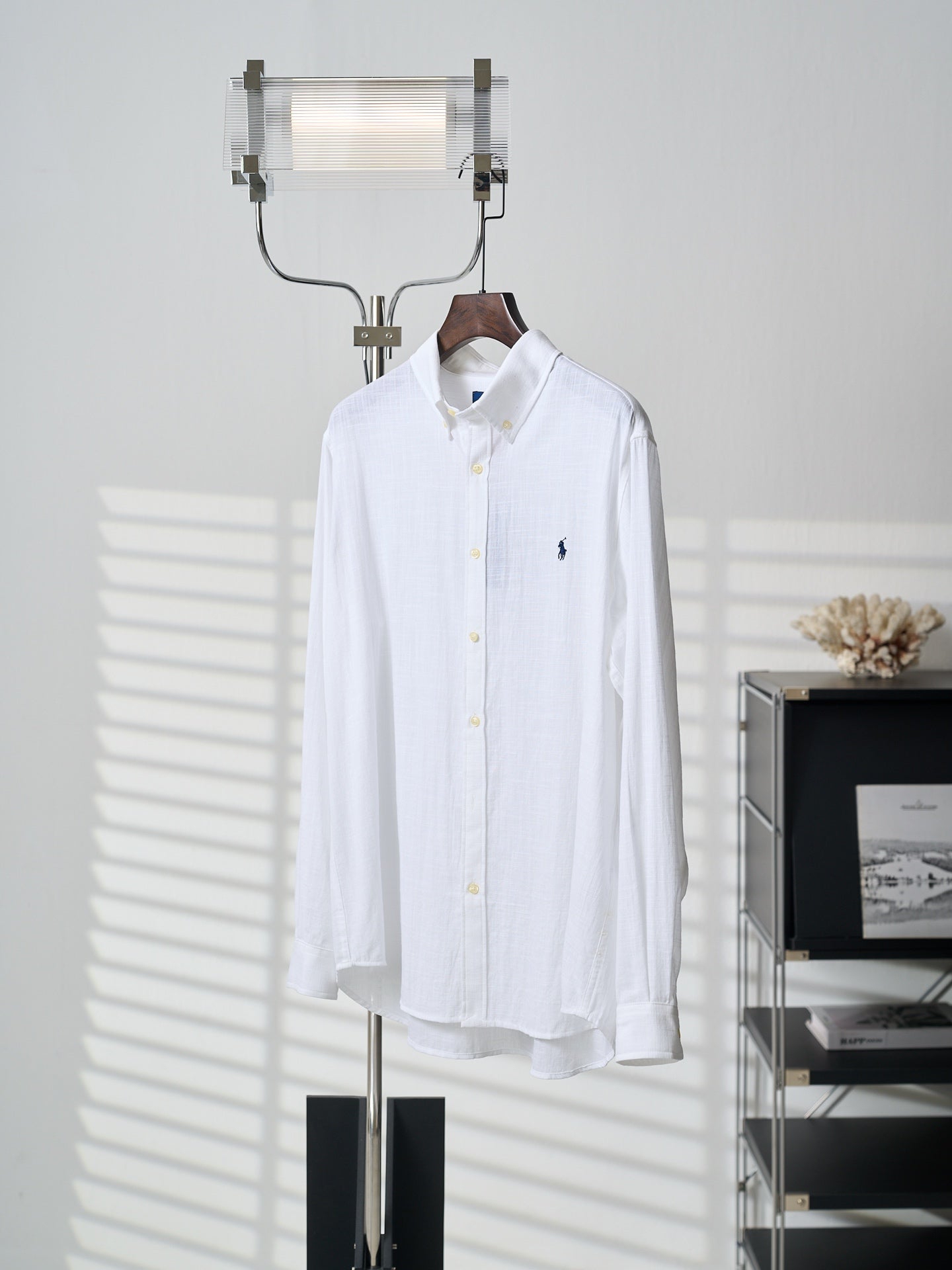 White button-up shirt with navy polo player logo on left chest, long sleeves