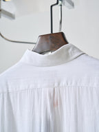White button-up shirt with stand collar and top button placket