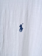 White shirt fabric with small navy polo player logo