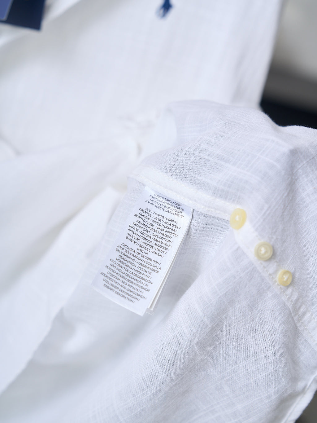 Ralph Lauren white button-up shirt, fabric label on chest