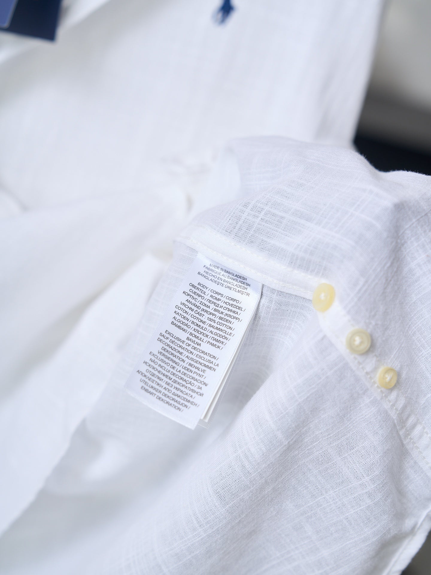 Ralph Lauren white button-up shirt, fabric label on chest