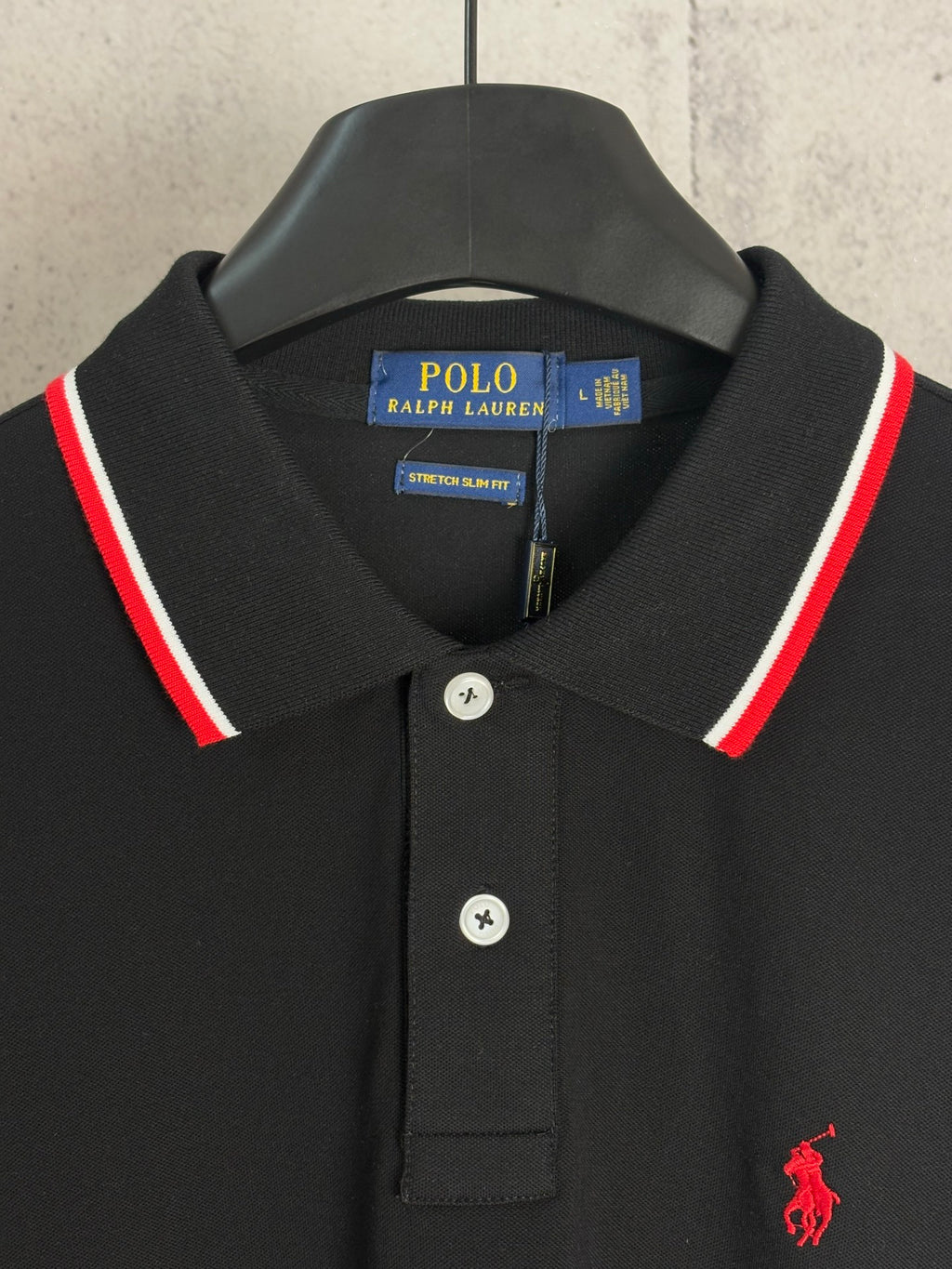 Black polo shirt with button placket, POLO Ralph Lauren tag, red pony logo