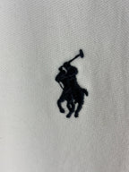 White polo knit with embroidered navy horse player logo