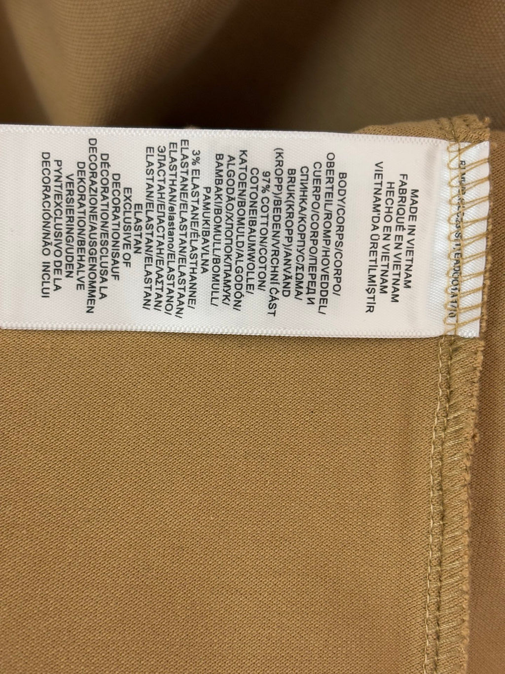Polo shirt care label stitched inside hem