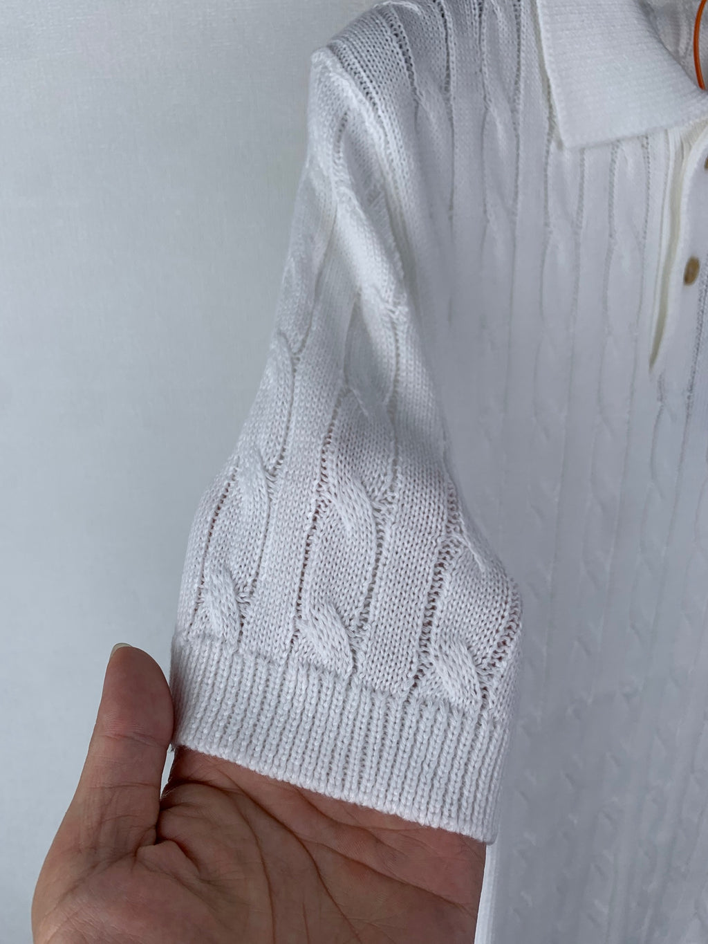 White cable-knit polo shirt sleeve cuff with ribbed knit hem