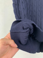 Dark navy cable-knit polo cuff with ribbed trim