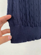 Dark navy cable-knit polo hem with ribbed trim