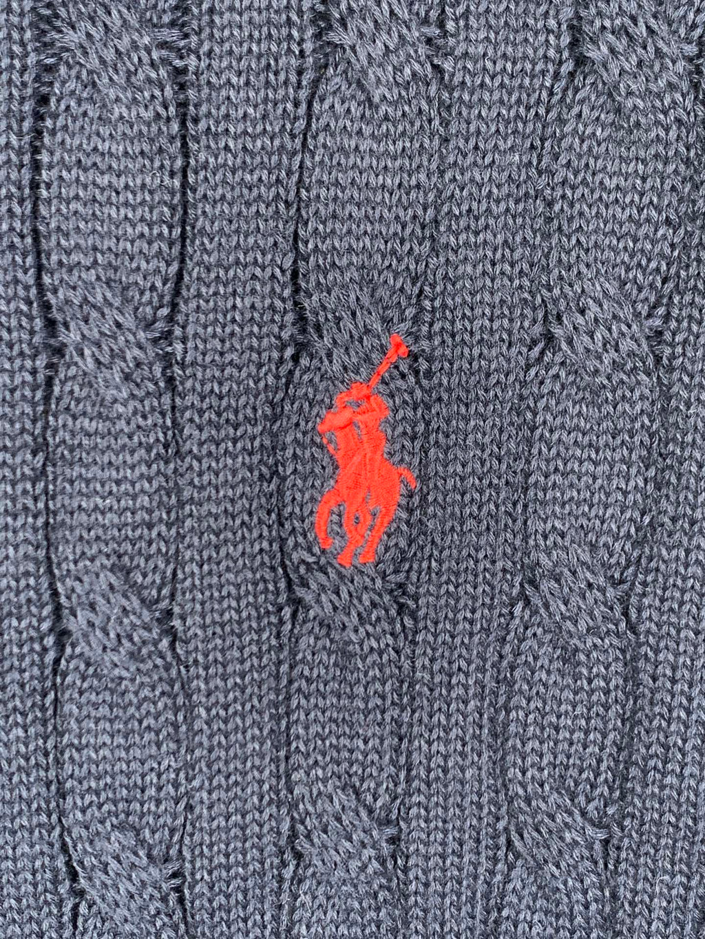 Dark navy cable-knit polo front with red horse logo
