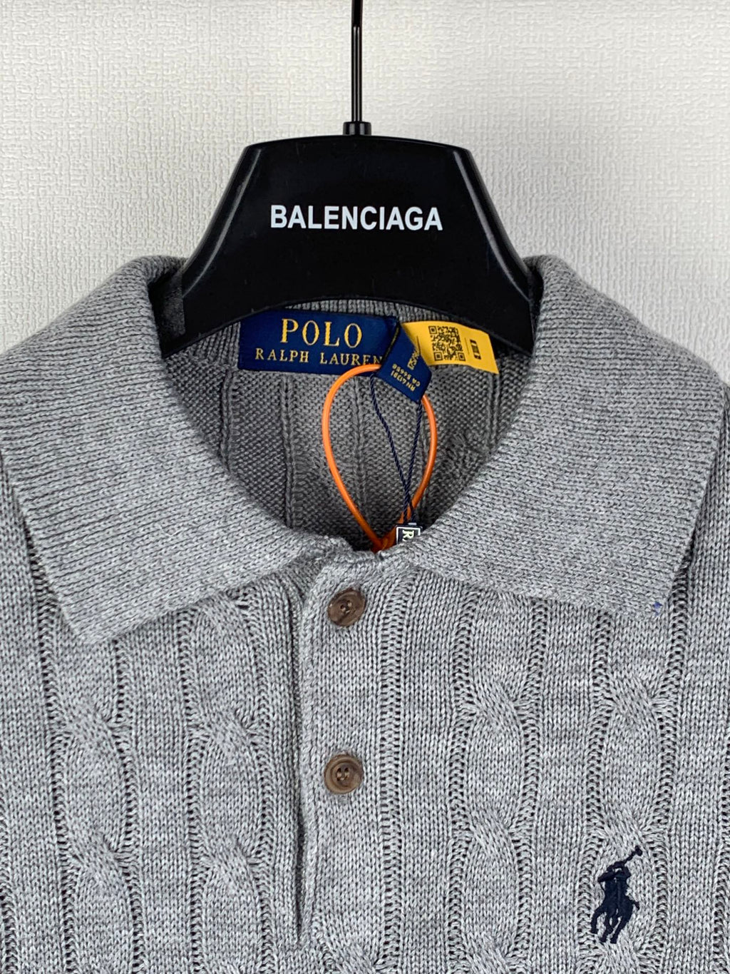 Polo Ralph Lauren knit polo sweater close-up of collar, buttons, and chest logo