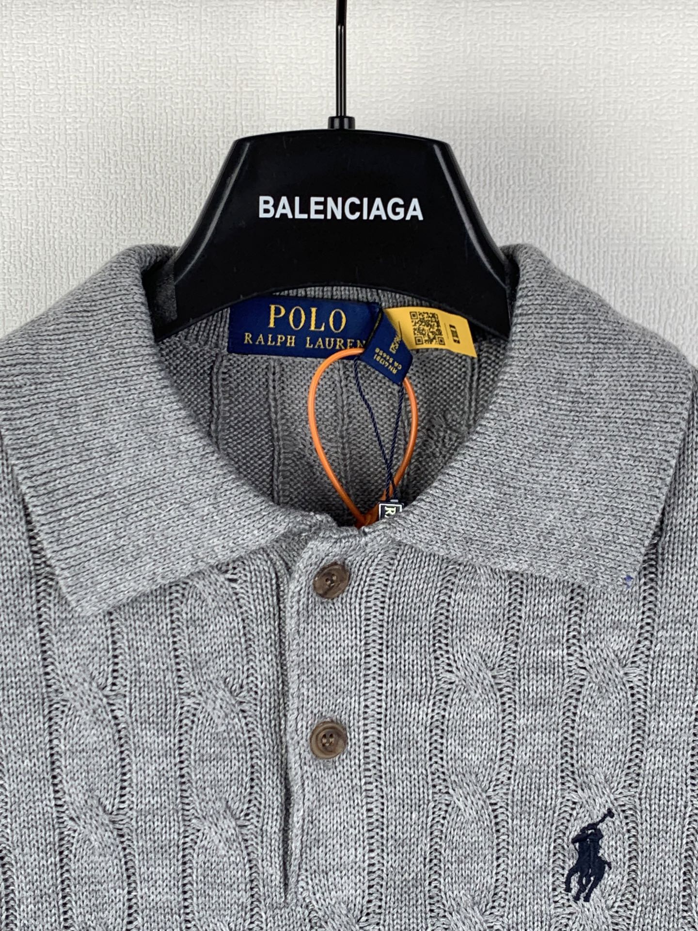 Polo Ralph Lauren knit polo sweater close-up of collar, buttons, and chest logo