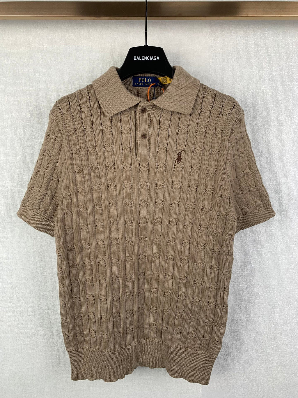 Ralph Lauren cable-knit polo shirt with short sleeves, button placket, and small chest logo