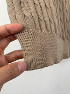 Ralph Lauren knit polo hem ribbing close-up with hand holding the fabric