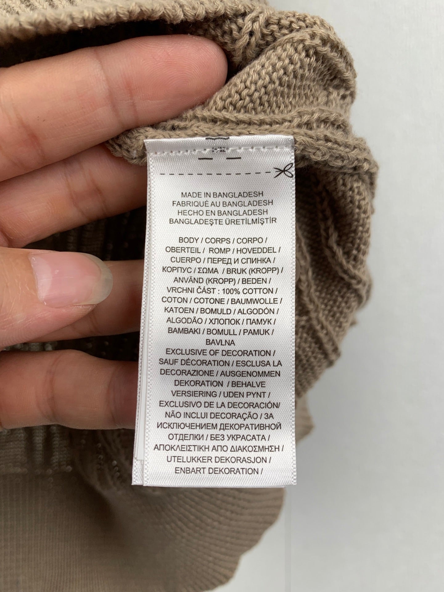 Ralph Lauren polo care label and fabric content tag sewn inside collar