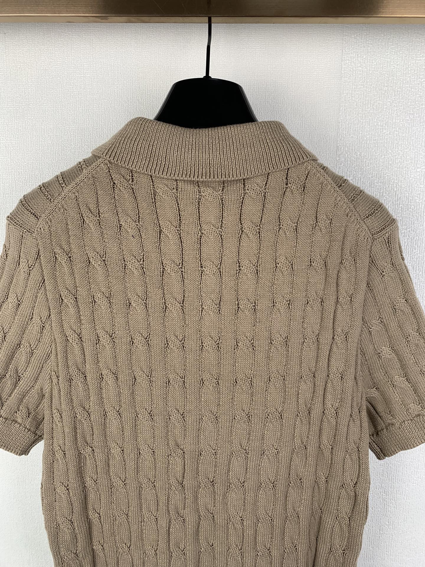 Ralph Lauren cable-knit polo shirt back view with ribbed collar and textured stitch pattern
