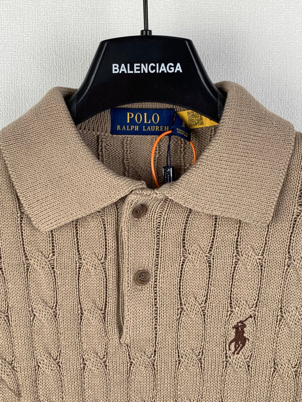 Ralph Lauren tan knit polo with spread collar, button placket, and small embroidered horse logo