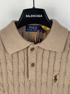Ralph Lauren tan knit polo with spread collar, button placket, and small embroidered horse logo