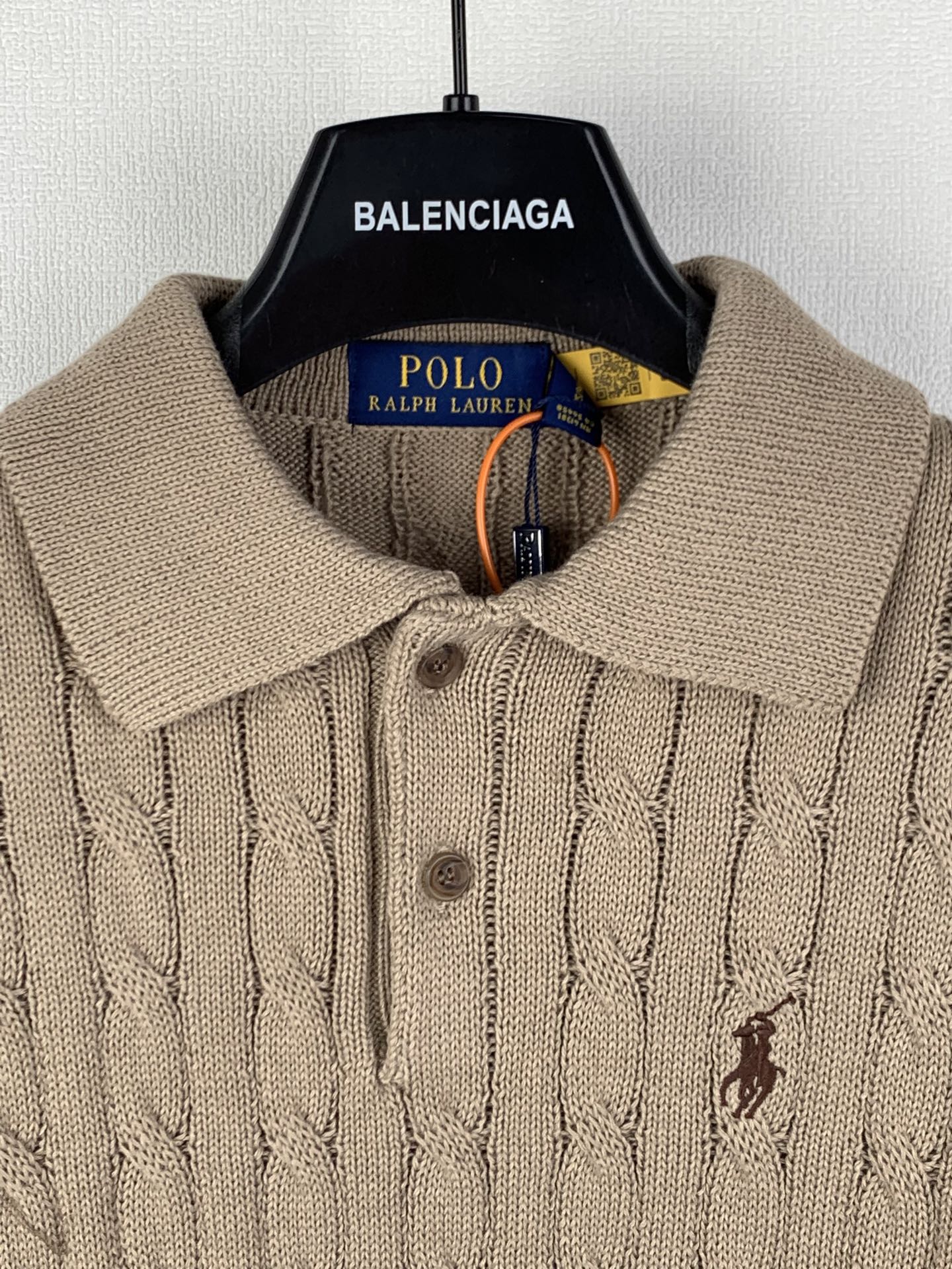 Ralph Lauren tan knit polo with spread collar, button placket, and small embroidered horse logo