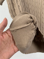 Ralph Lauren knit polo sleeve cuff and hem close-up, folded fabric detail