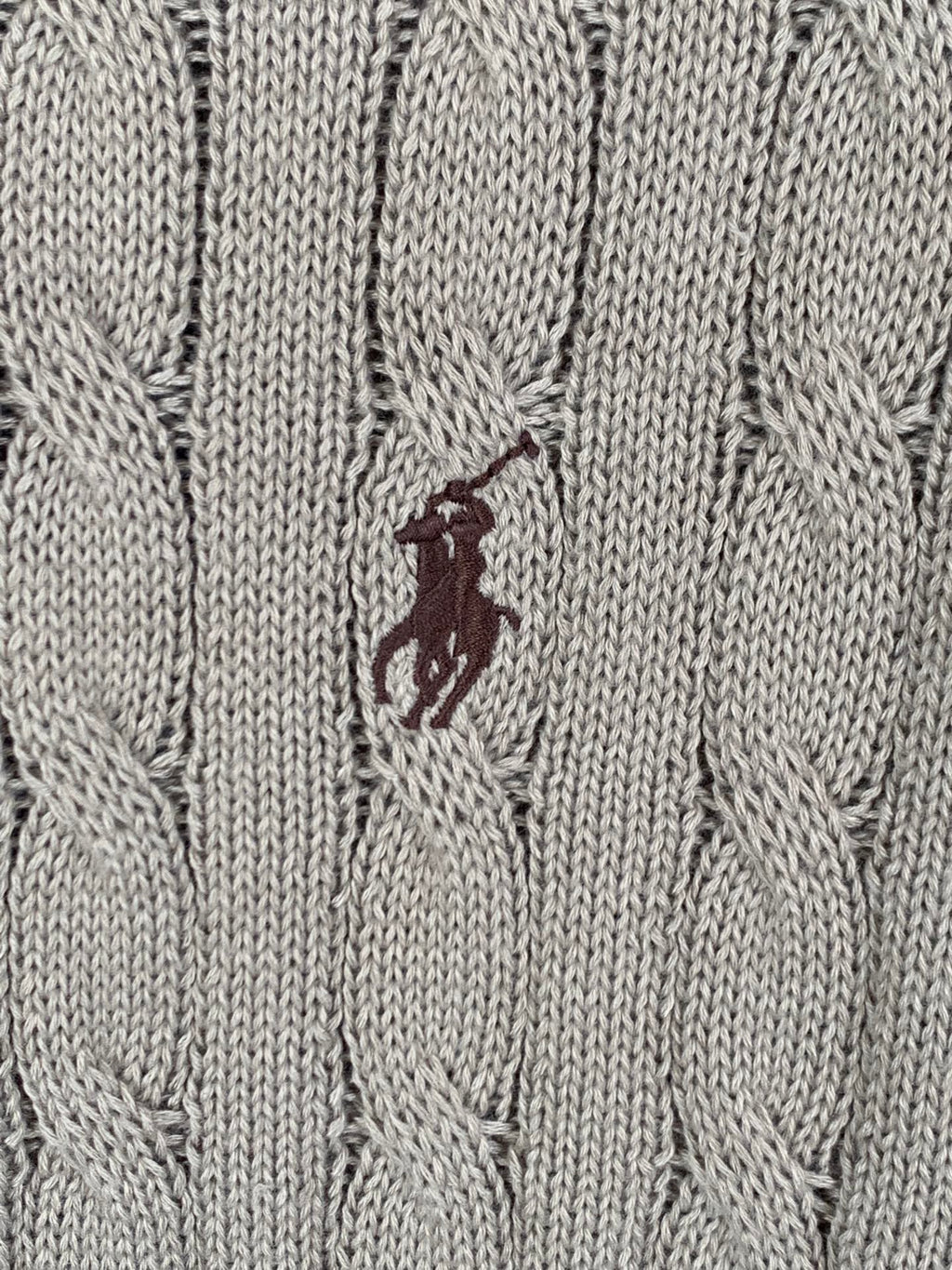 Ralph Lauren knit polo fabric detail with small embroidered horse logo