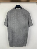 Gray knit polo shirt back view with cable texture and ribbed crew neckline