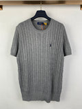 Gray knit polo shirt with cable texture, crew neck and short sleeves, small navy logo