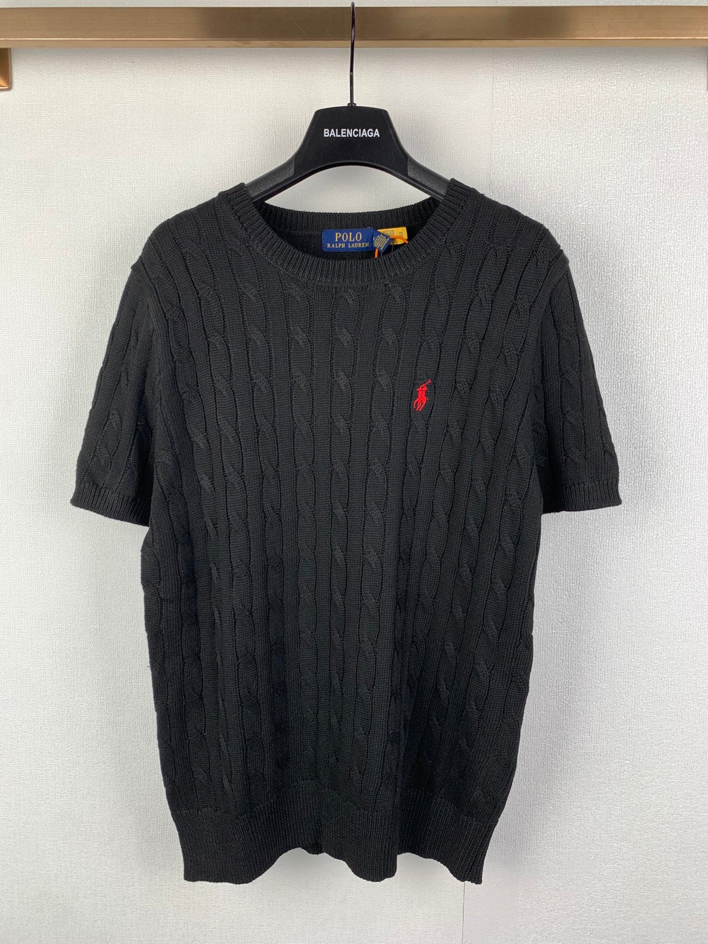 Ralph Lauren cable-knit sweater, dark knit with small red logo on chest