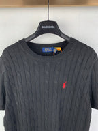 Cable-knit sweater neckline with Polo Ralph Lauren label inside crew neck collar