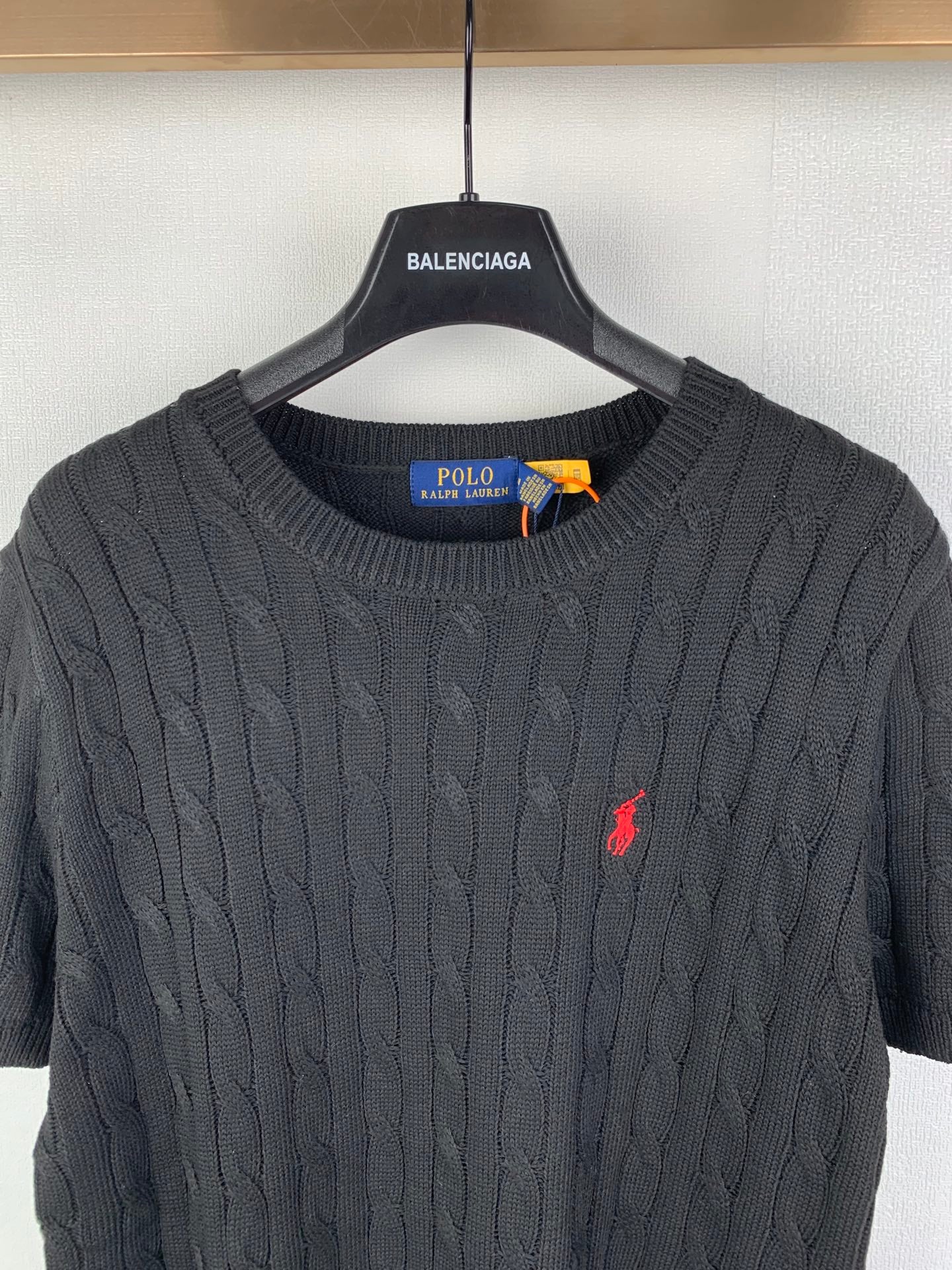 Cable-knit sweater neckline with Polo Ralph Lauren label inside crew neck collar