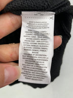 Clothing care label text: Made in Bangladesh and cotton blend instructions