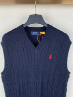 Navy cable-knit sweater vest with V-neck and red polo logo