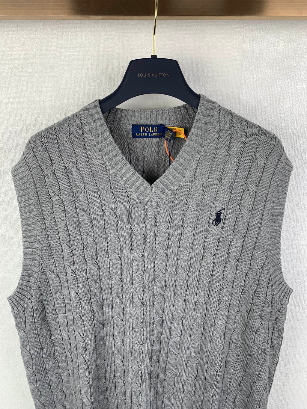Gray cable-knit sleeveless sweater vest with V-neck and Polo logo detail