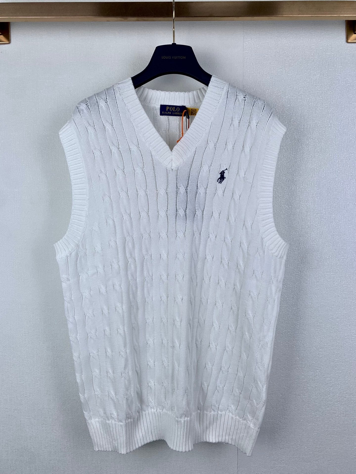 White cable-knit sweater vest with V-neck and small Polo logo on chest