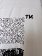 OffWhite™ T-shirt detail, off-white with textured arrow graphic and TM