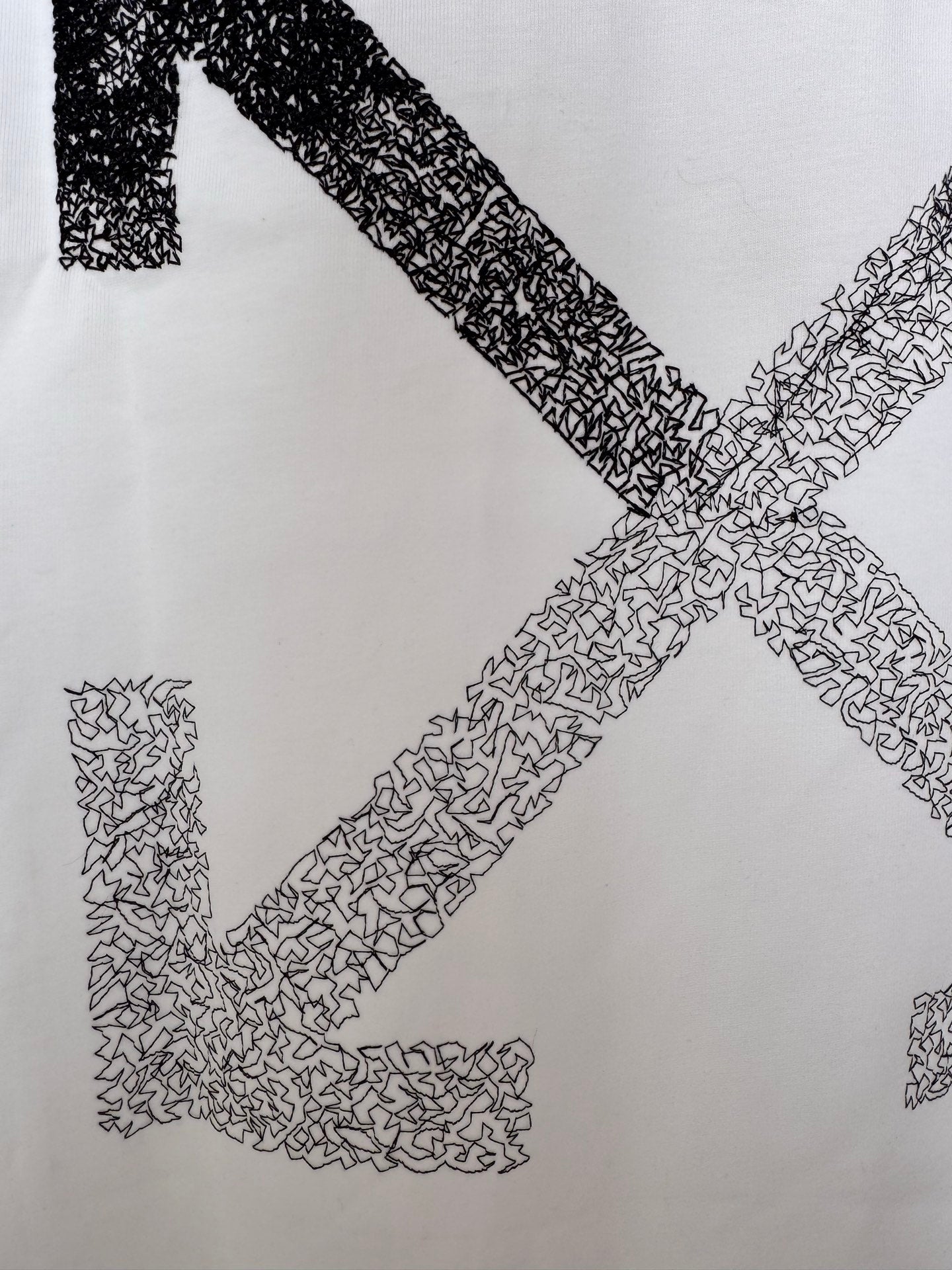OffWhite™ T-shirt graphic detail, off-white with cross arrows textured pattern