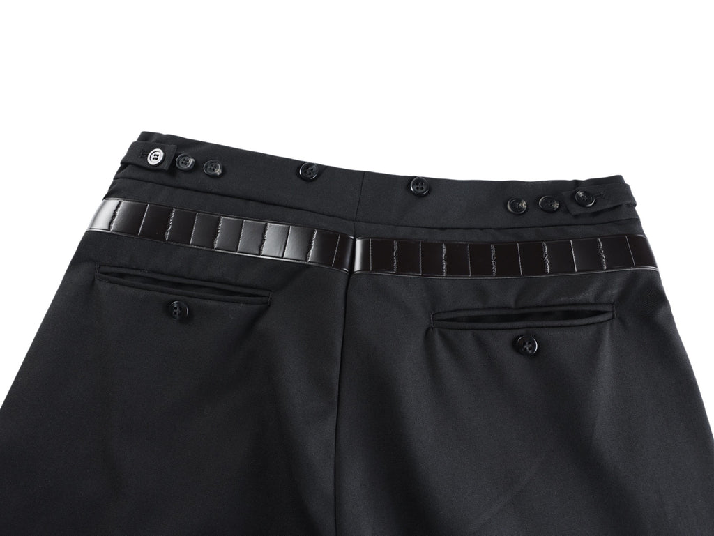 Black pants front with belt strap, metal buckle, and buttoned waistband