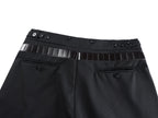 Black pants front with belt strap, metal buckle, and buttoned waistband
