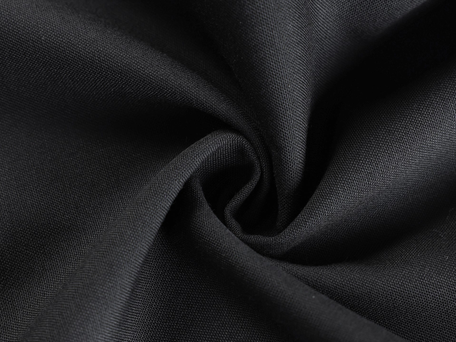 Black fabric close-up with fine textured weave