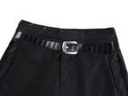 Black pants waistband with belt strap, metal buckle, and decorative belt loops
