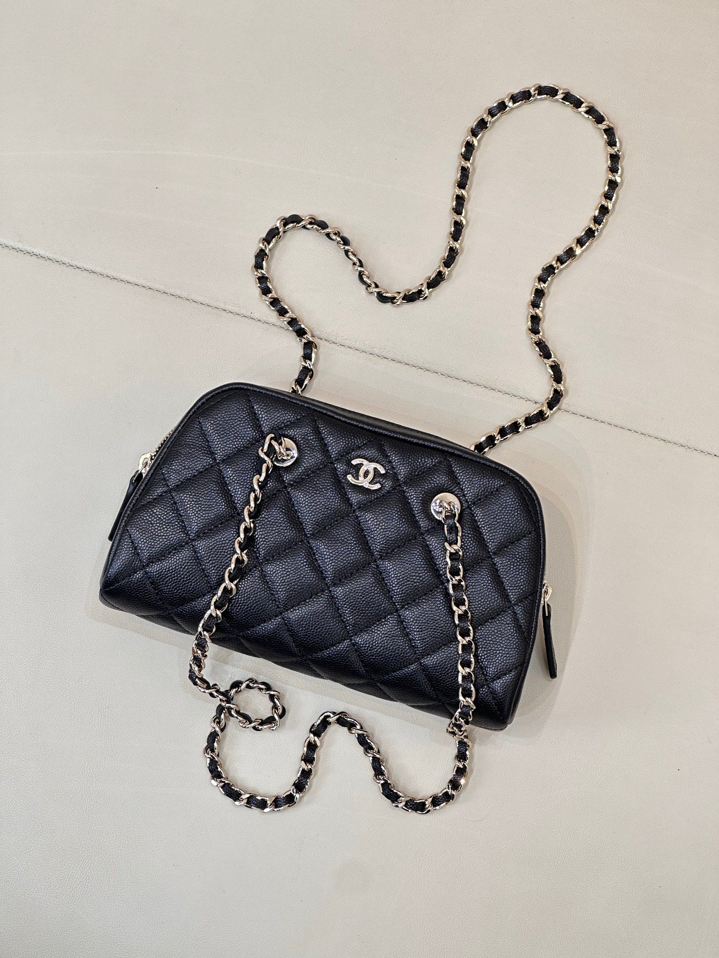 Chanel quilted crossbody bag, dark blue, with chain shoulder straps and zipper top