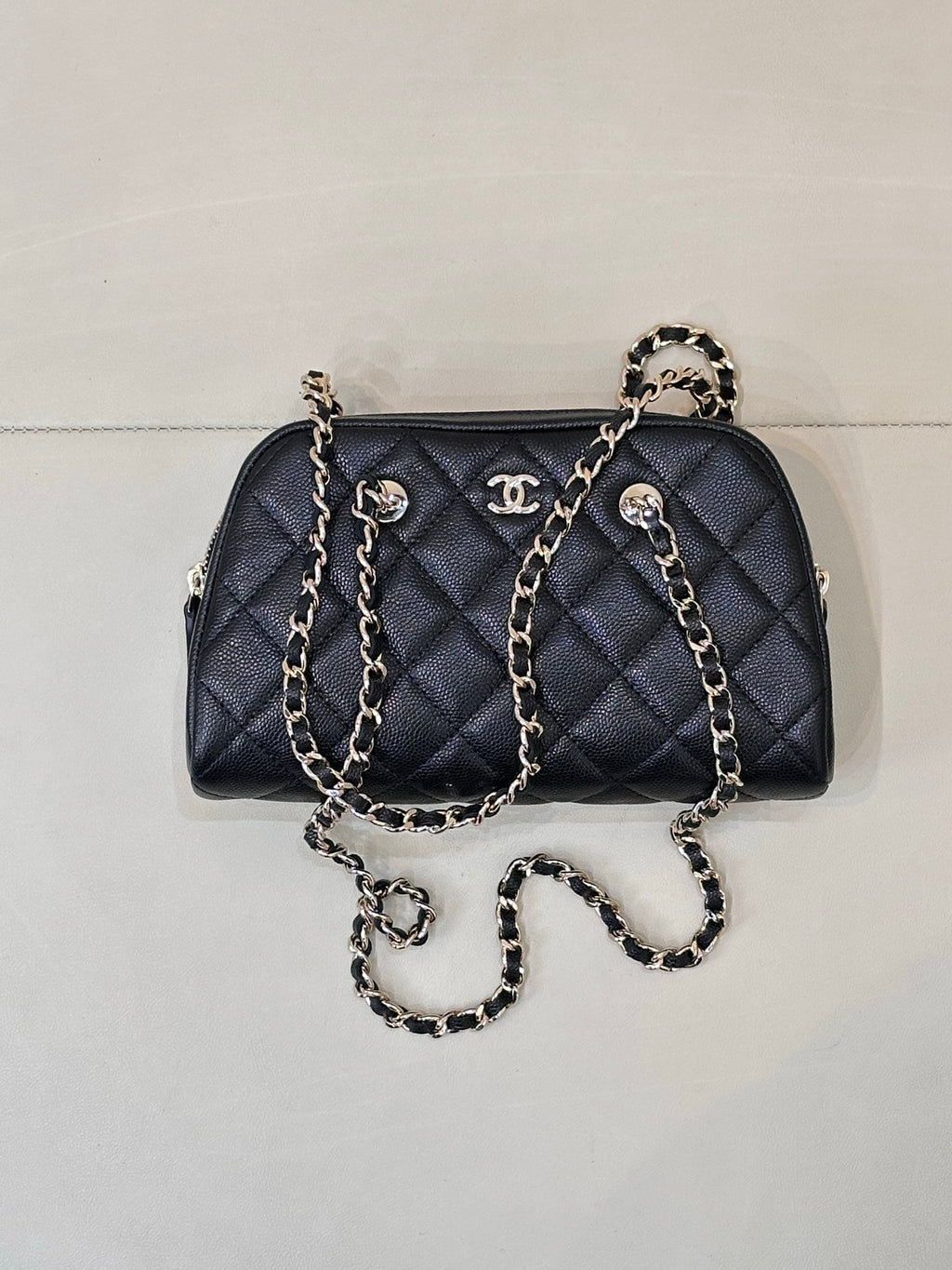 Chanel quilted bag in dark blue with chain straps and gold-tone logo accents