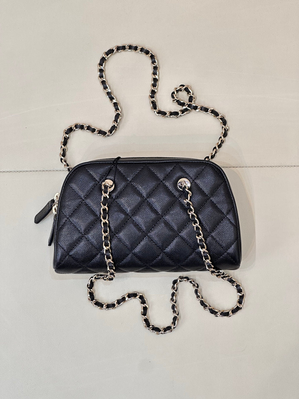 Chanel quilted crossbody bag in dark blue with chain shoulder strap and side tabs