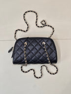 Chanel quilted crossbody bag in dark blue with chain shoulder strap and side tabs