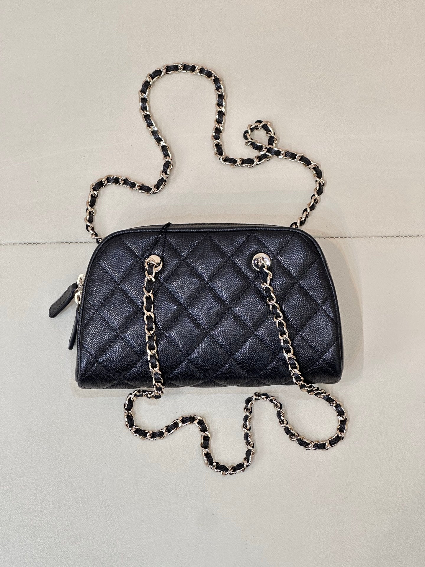 Chanel quilted crossbody bag in dark blue with chain shoulder strap and side tabs