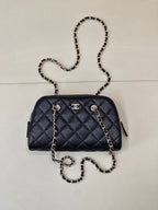 Chanel quilted crossbody bag in dark blue with chain strap and gold-tone hardware
